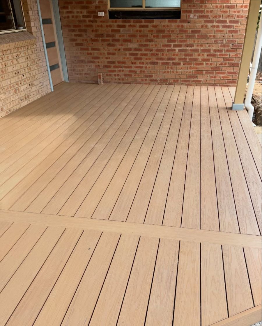 Wooden Deck Extending from A Brick Wall — Express Timber Solutions In Long Jetty, NSW