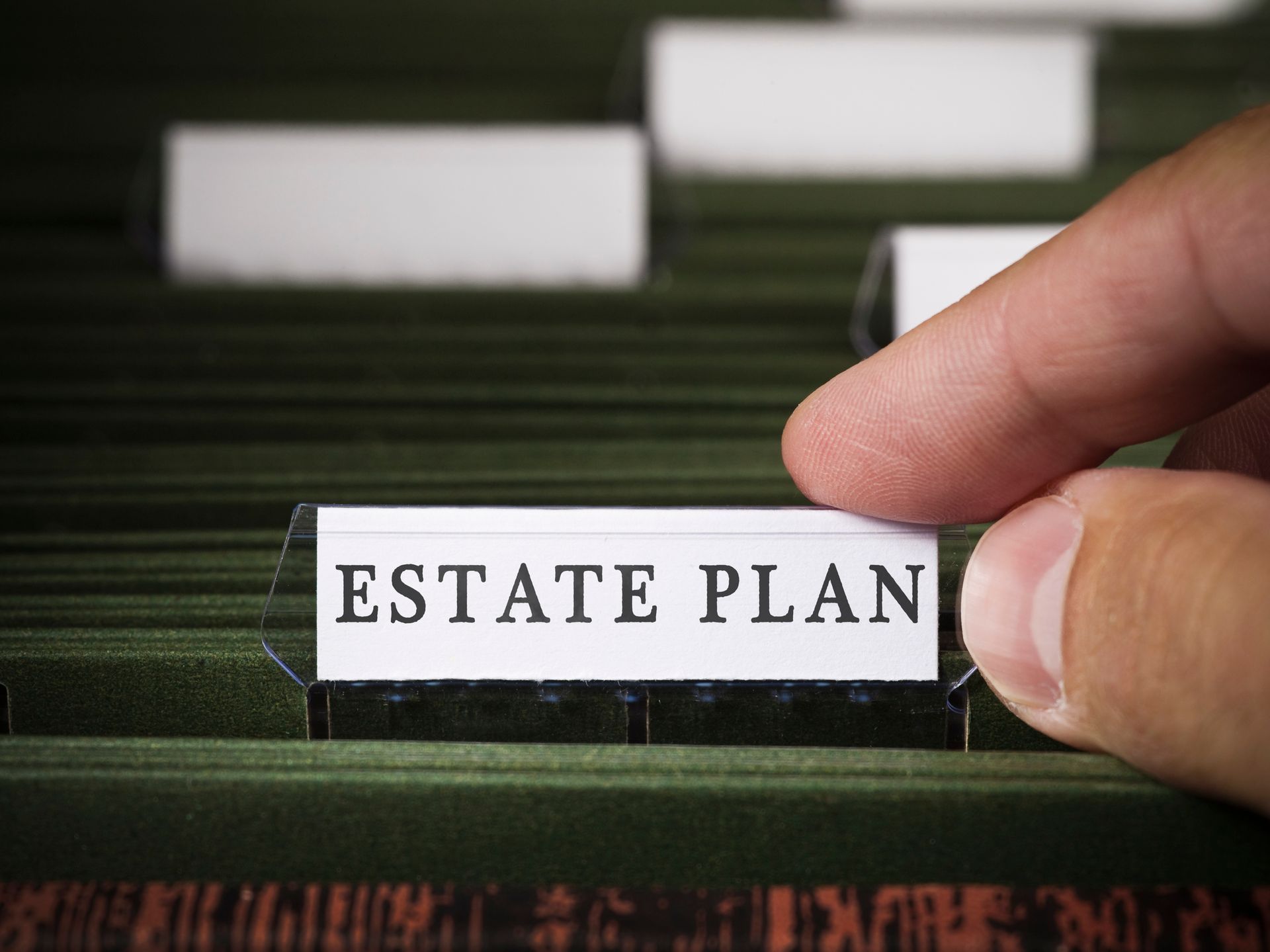 Hand pulling a labeled Estate Plan