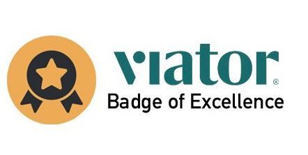 A logo for viator badge of excellence with a star on it