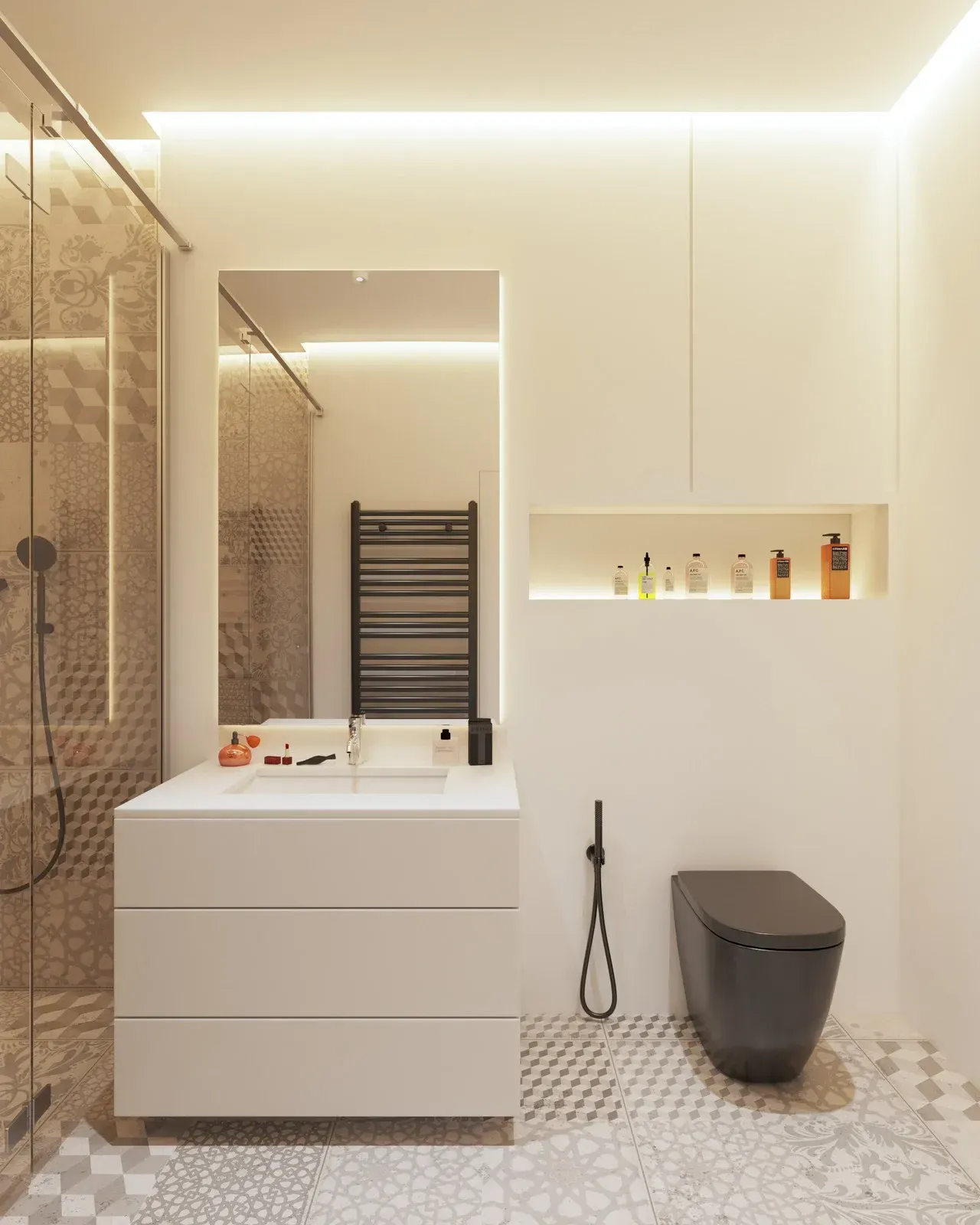 Modern bathroom with white vanity, black toilet, and patterned tile floor.