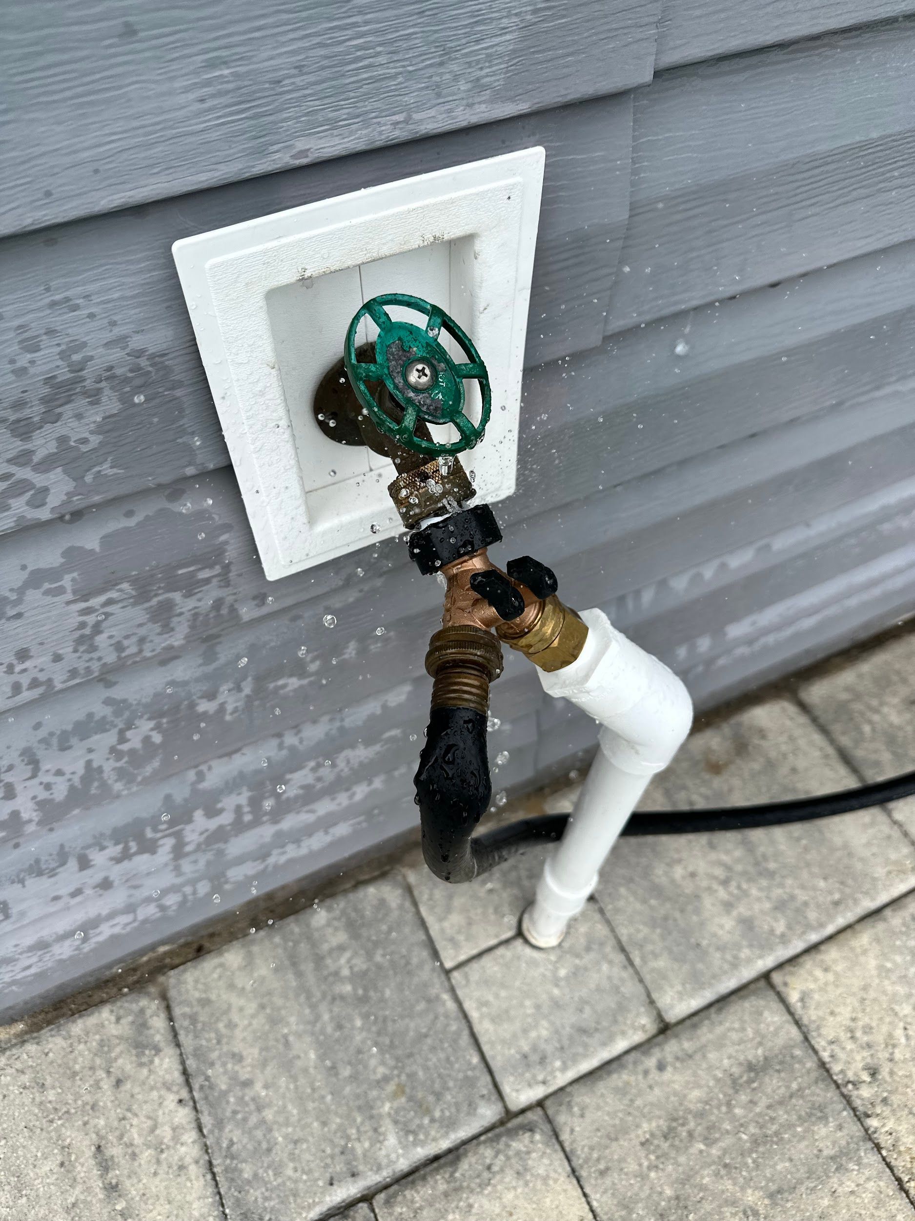 Copper plumbing pipes with soldered elbow joint.