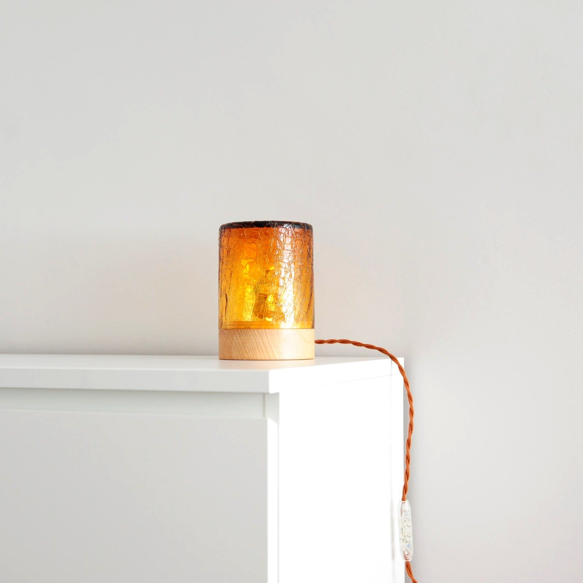 table lamp with crackled orange glass and wood base