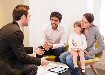 Young Family Meeting with a Financial Adviser to Buy a Property — Friendly Finance in Central City, KY