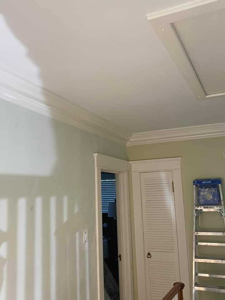 A room with a ladder and a door in it.