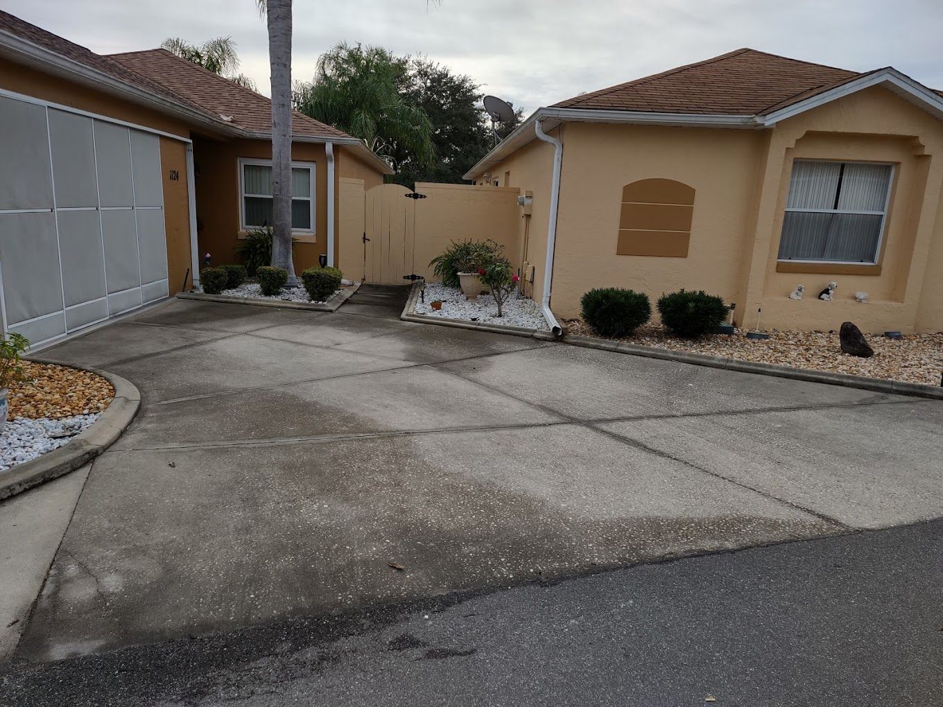 A driveway leading to a house with a garage