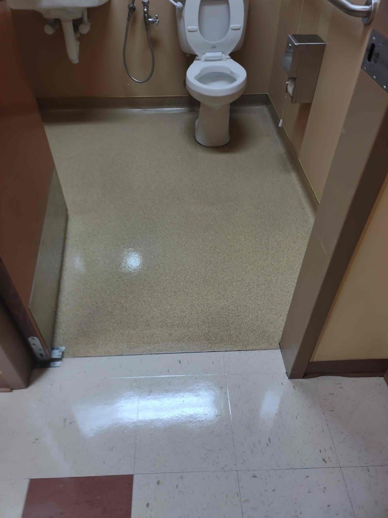 A bathroom with a toilet and sink in it