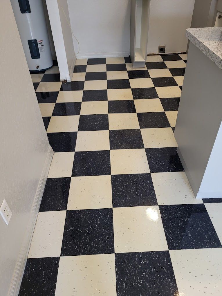A black and white checkered floor in a kitchen