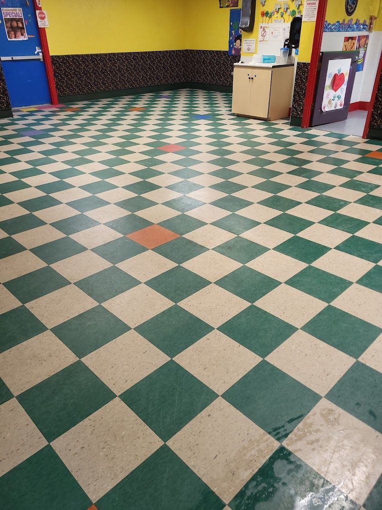 A room with a green and tan checkered floor