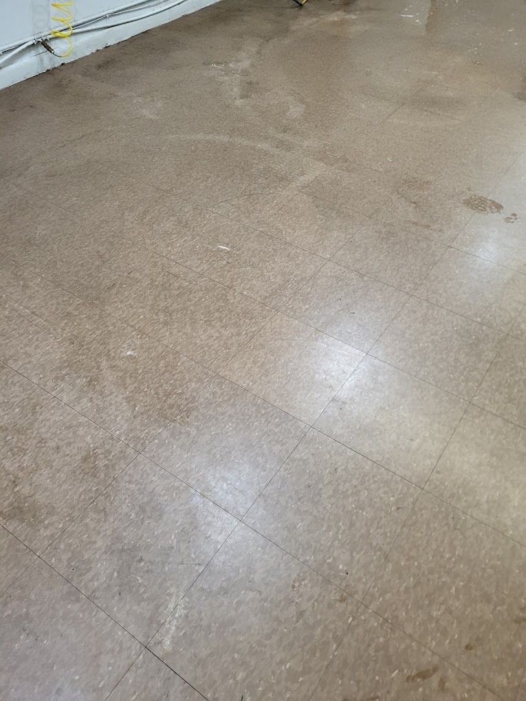 A close up of a tiled floor in a room.