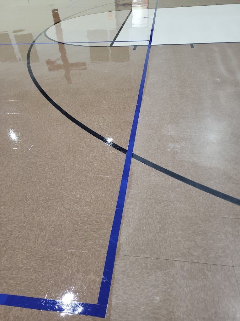 A basketball court with a blue line on it