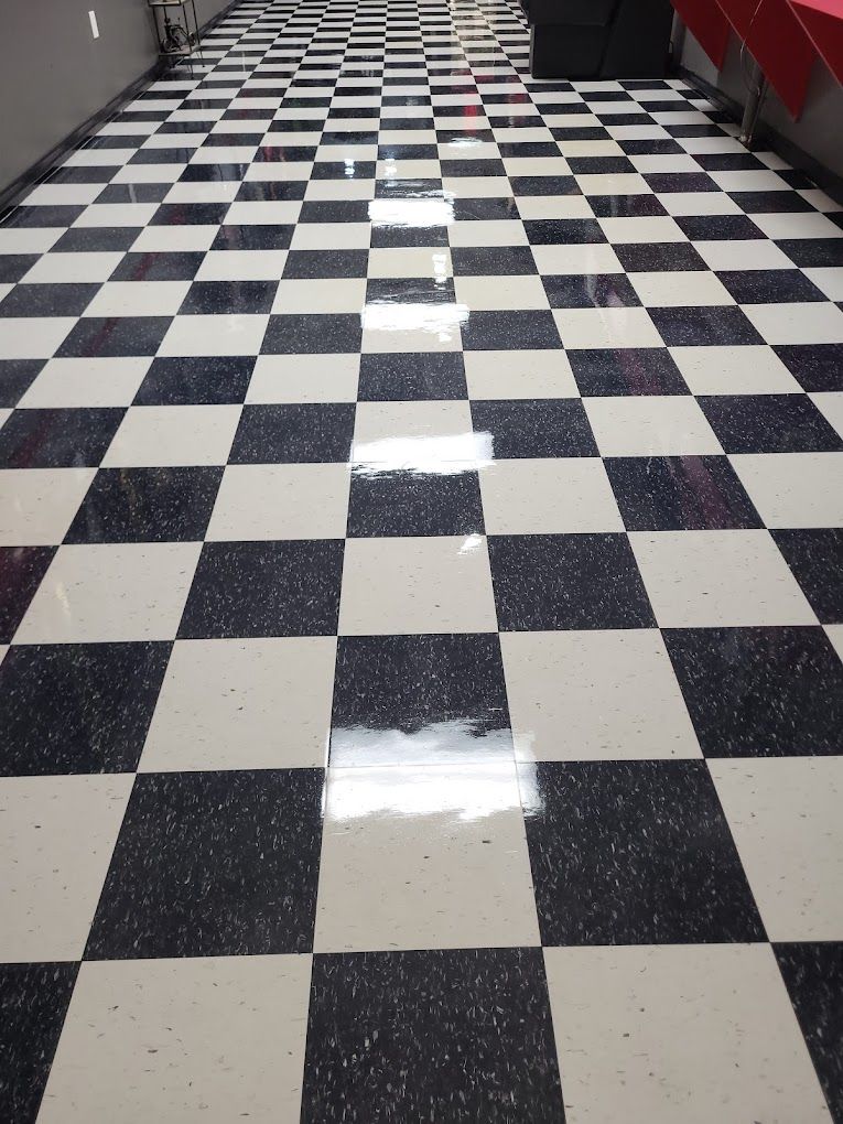 A black and white checkered floor in a hallway