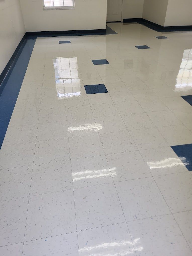 A white and blue tile floor in a room