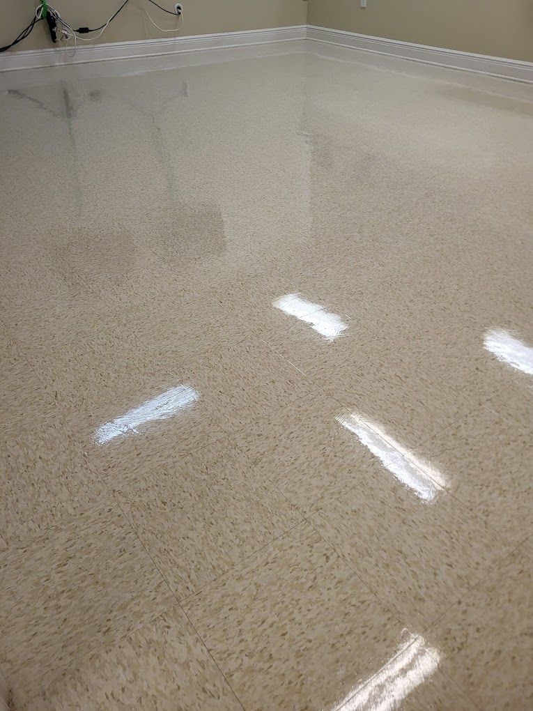 A close up of a shiny floor in a room.