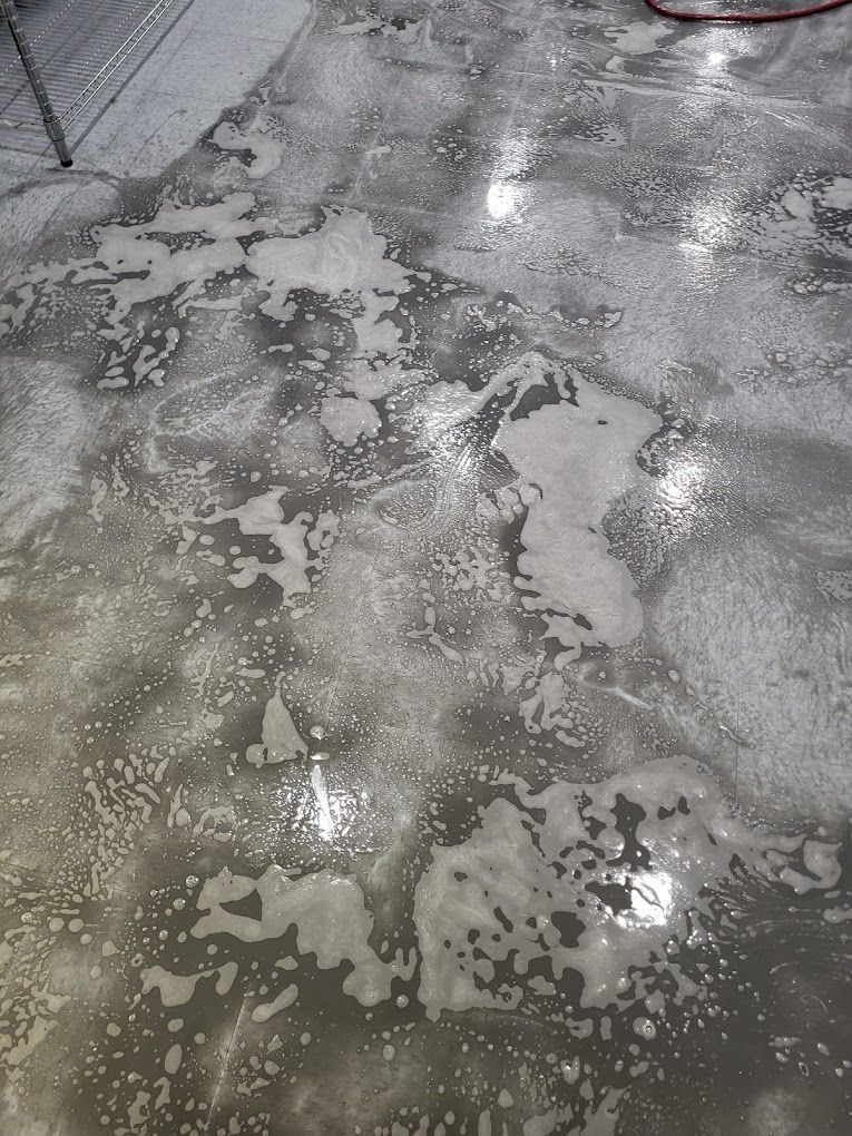 A concrete floor with a lot of foam on it