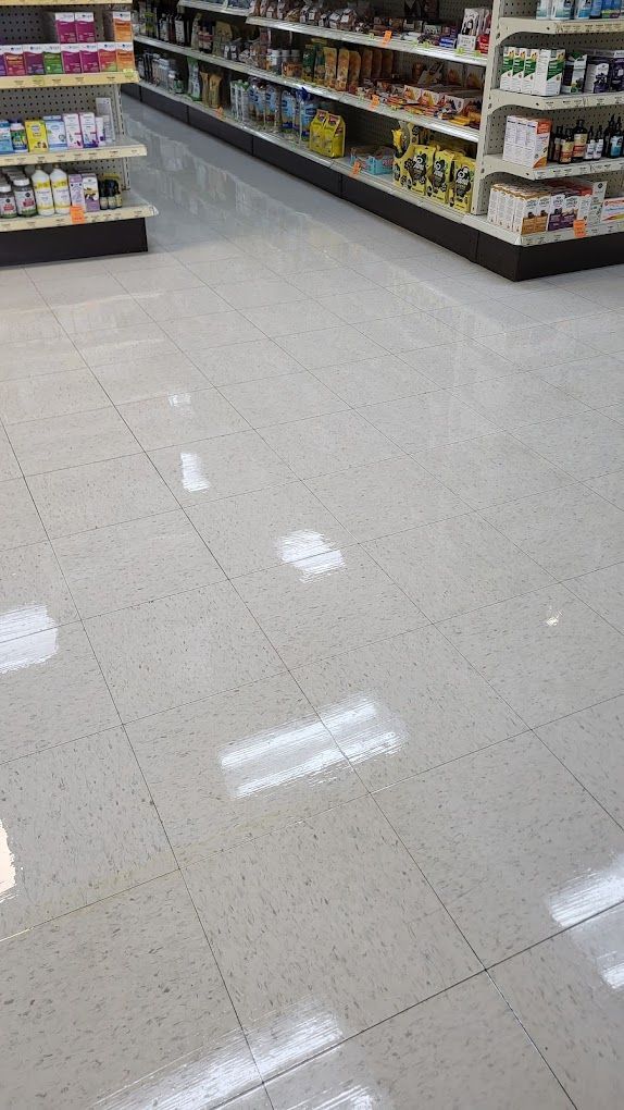 The floor of a grocery store is shiny and clean.