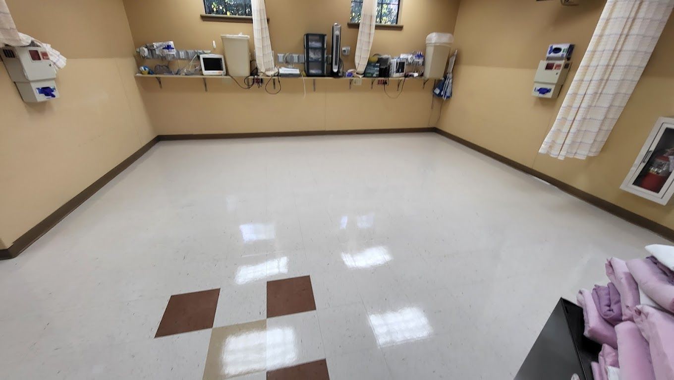 A hospital room with a white floor and a checkered floor.