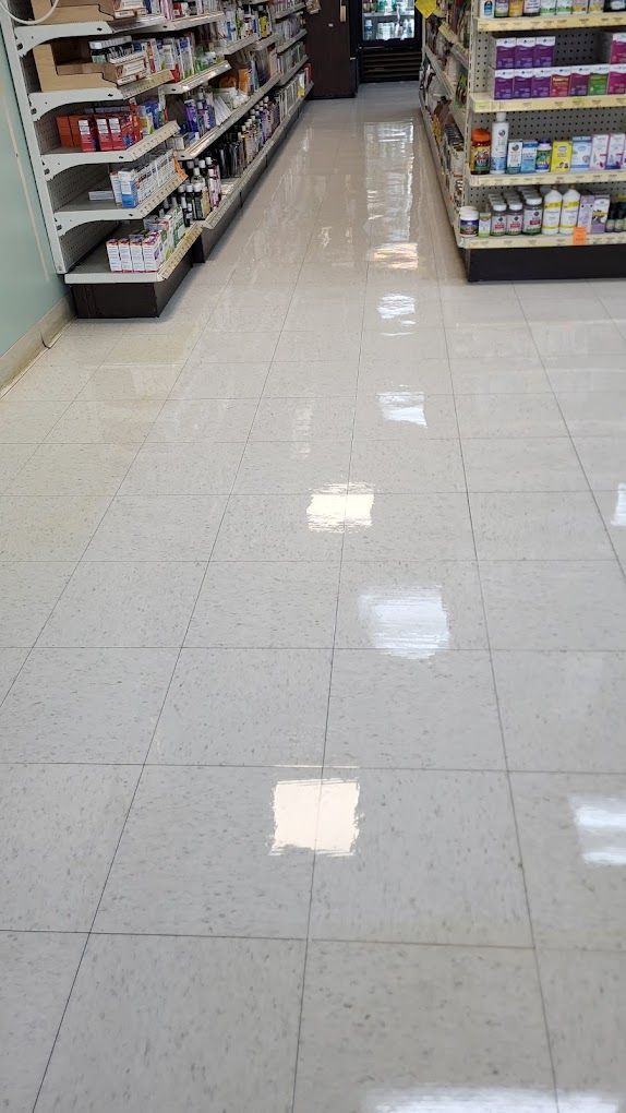 A row of shelves in a store with a tiled floor.