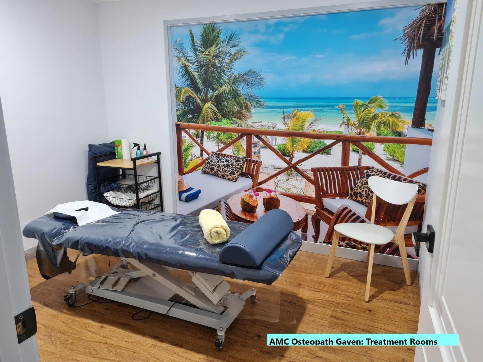 Osteopathic Clinic treatment room with tropical background scene at Gaven on the Gold Coast