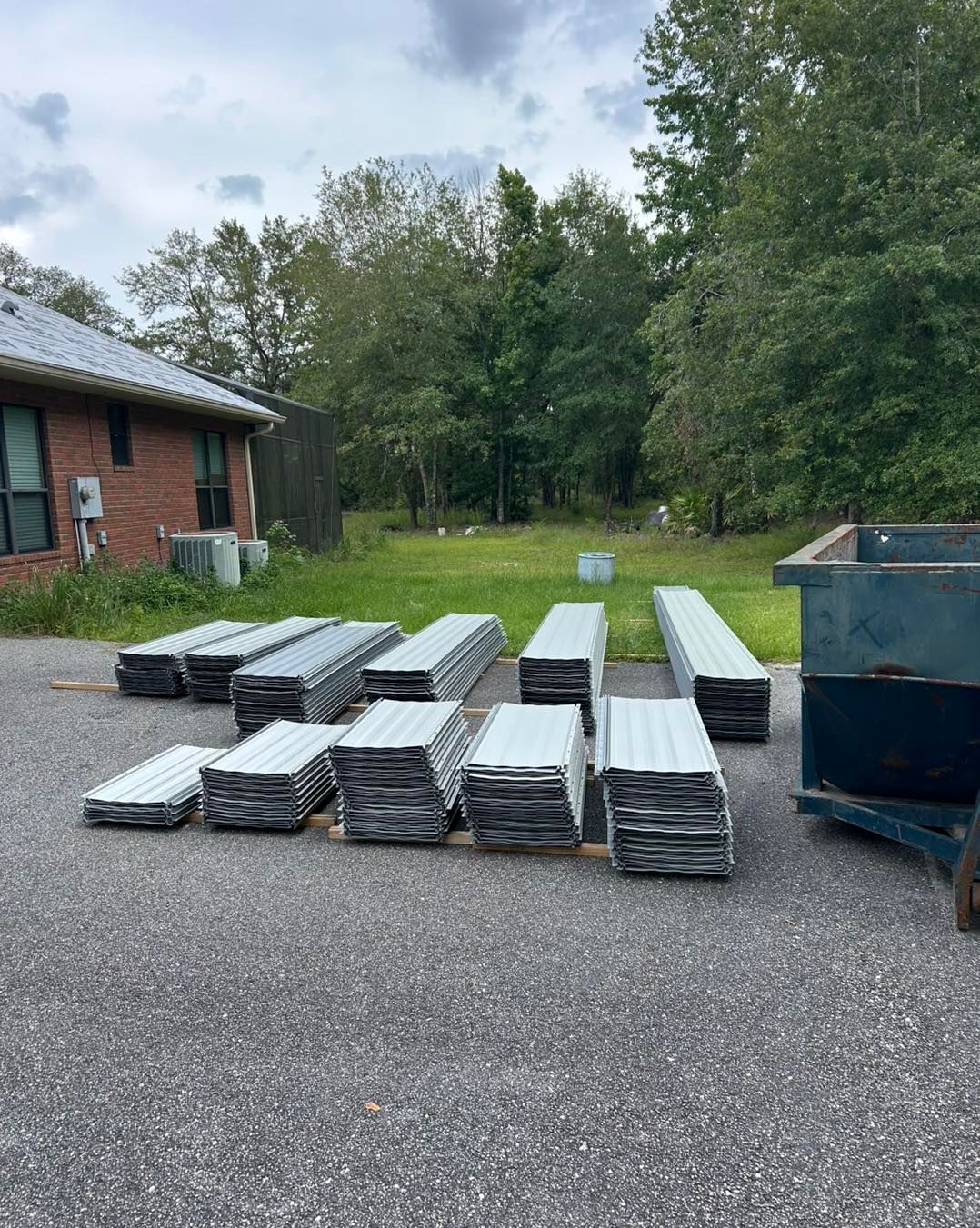 Bright industrial warehouse with a detailed metal roof structure under natural light.