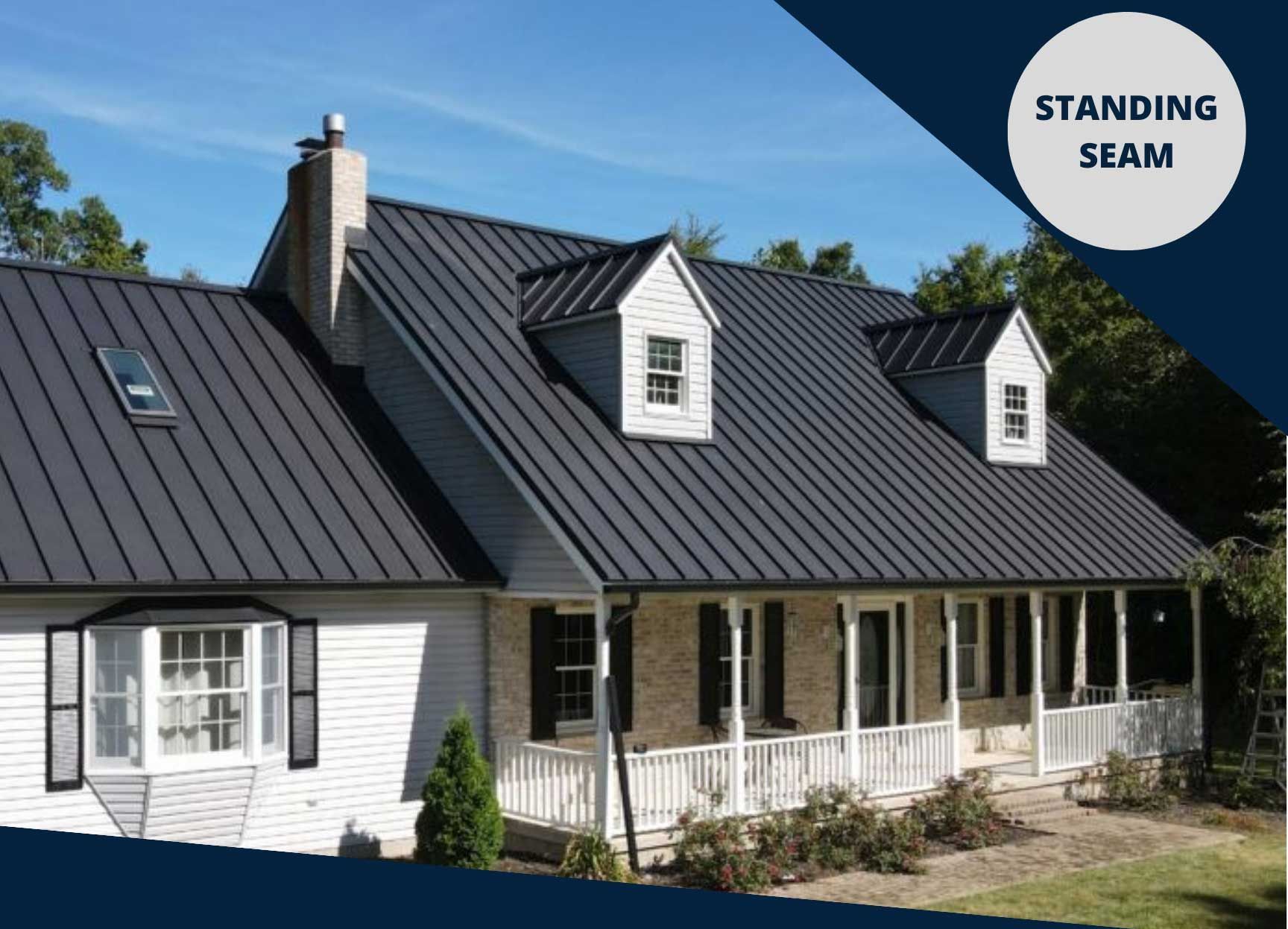 A white house with a black roof and a standing seam roof