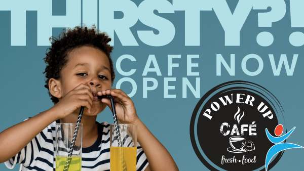 Boy drinking two colorful drinks through straws at 