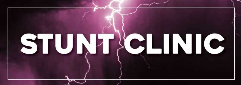 A sign that says stunt clinic with a lightning bolt in the background
