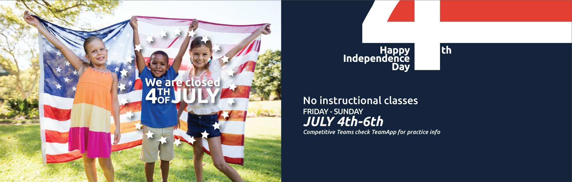 A group of children are holding american flags in a park.