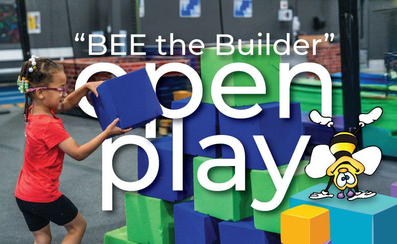 Girl stacking blue blocks at 
