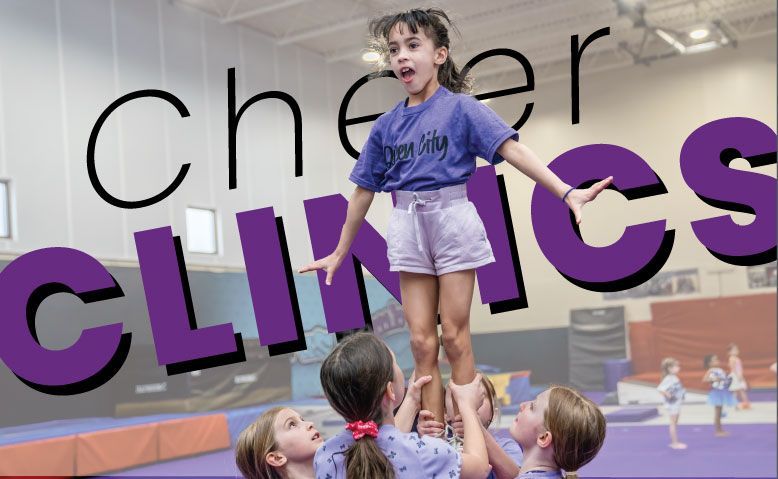 A girl is being lifted in the air in front of the word cheer clinics