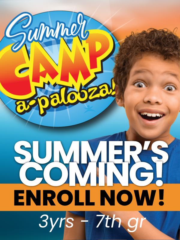 An excited child poses next to a