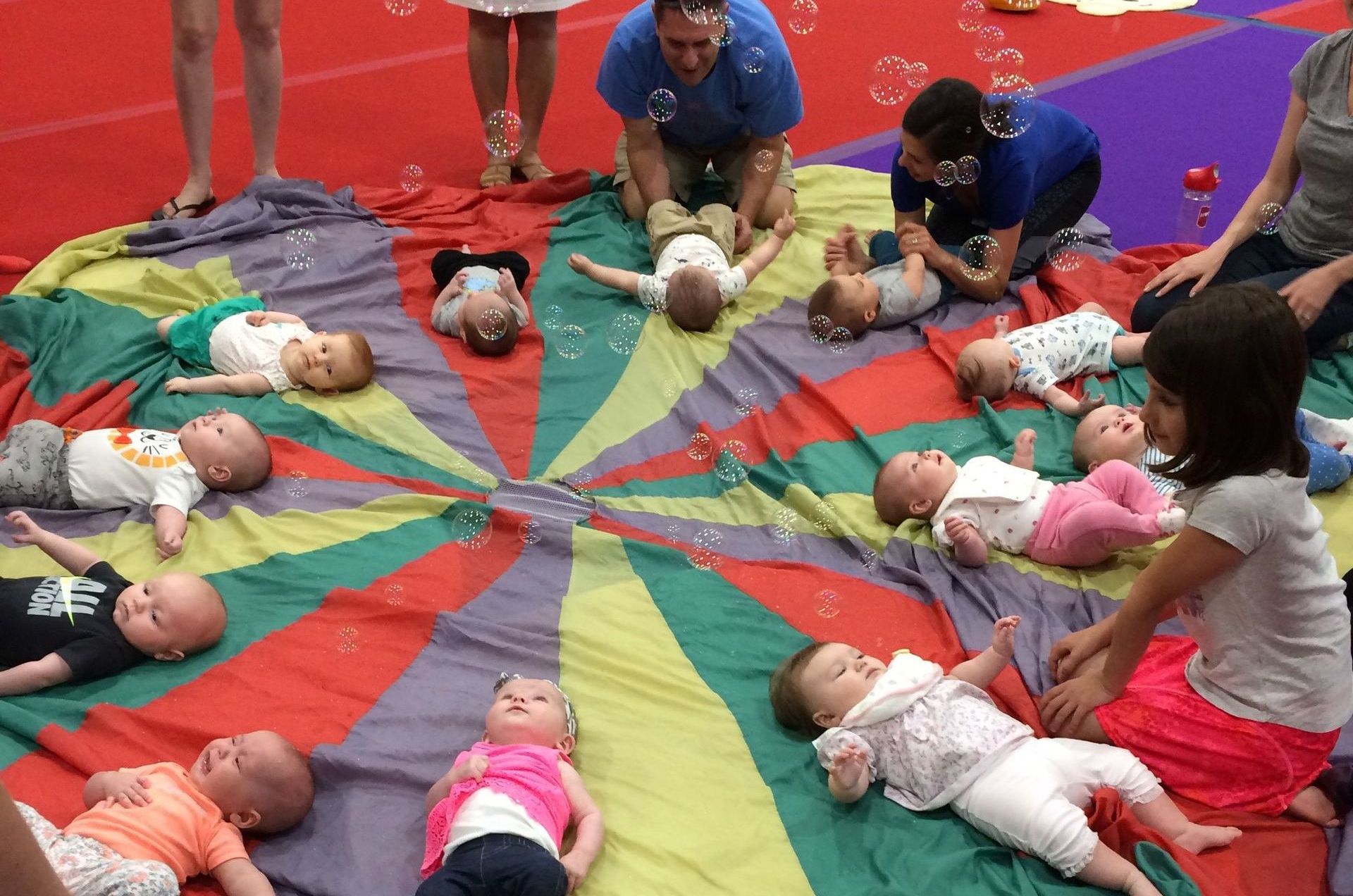 Tumble Bees Babies laying on parachute