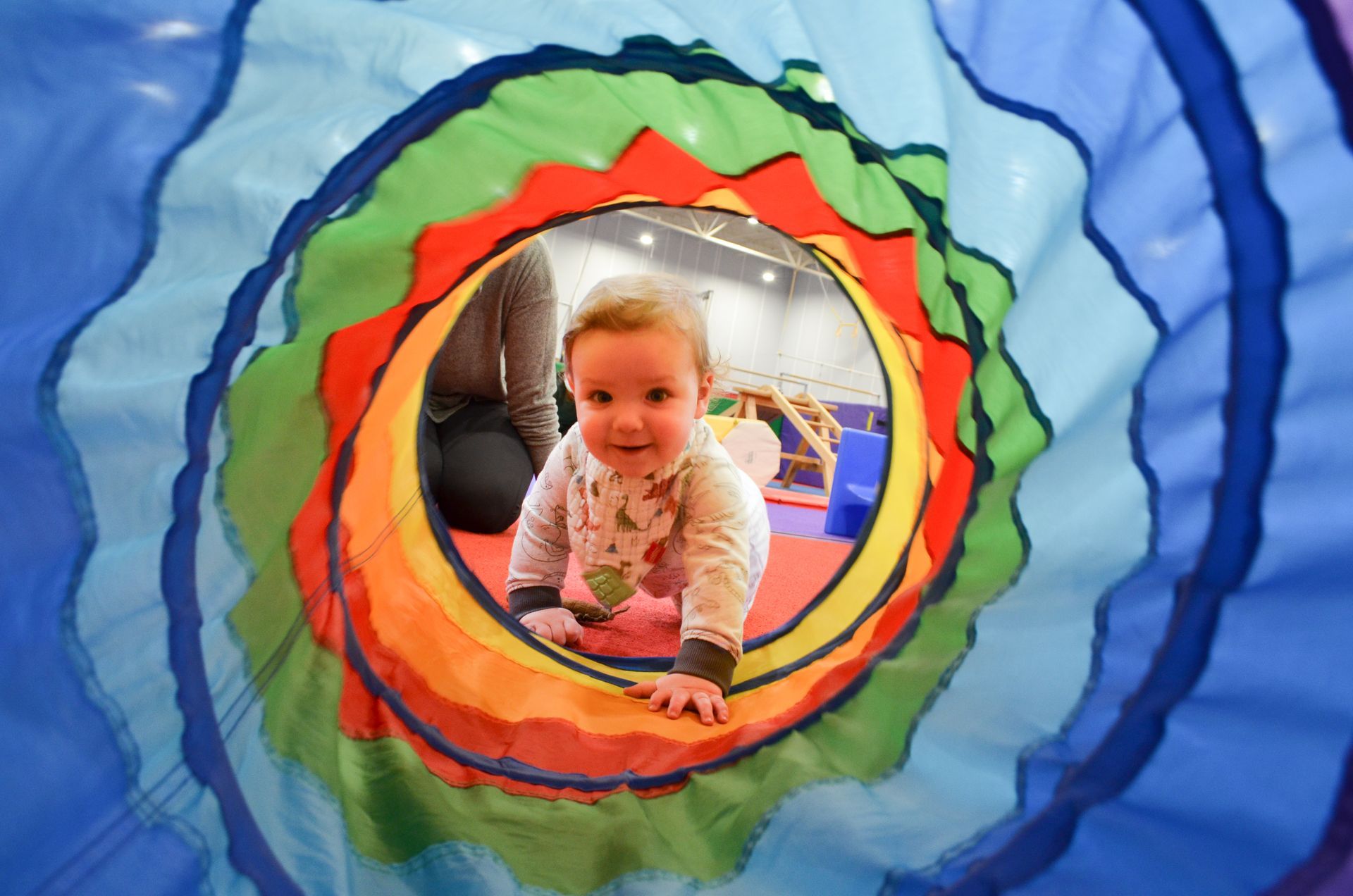 baby crawling through tunnel