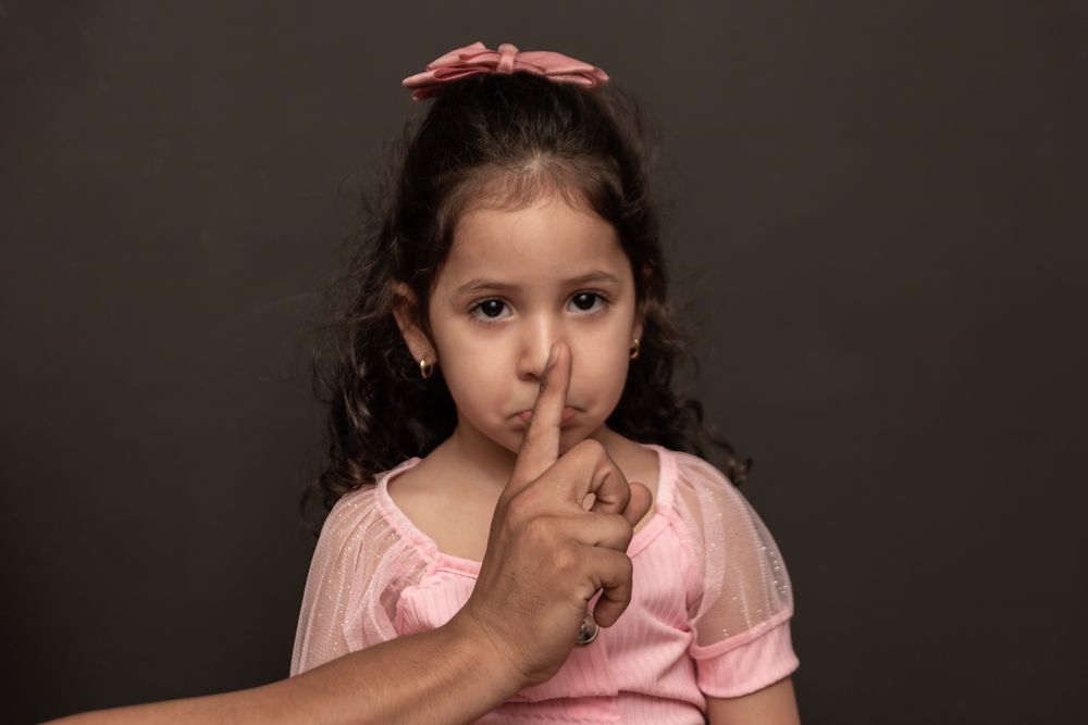 A Young Girl Is Sitting On A Couch Talking To A Woman — Noosa Psychological Services in Noosa Heads, QLD