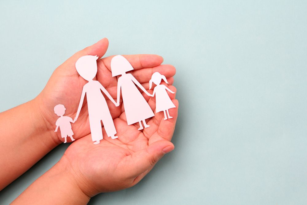 A Pink Ribbon Is Sitting On A White Wooden Table — Noosa Psychological Services in Noosa Heads, QLD