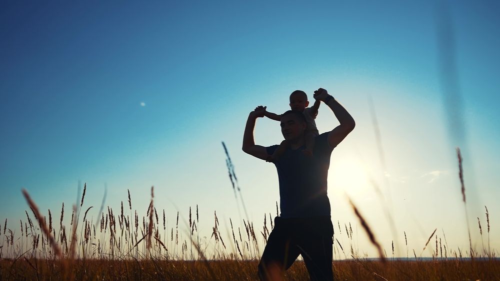 A Woman Is Standing In Front Of A Laptop Computer In An Office — Noosa Psychological Services in Noosa Heads, QLD