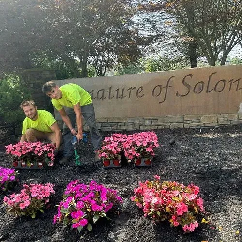 Ground Up Crew Planting Flowers at Signature of Solon