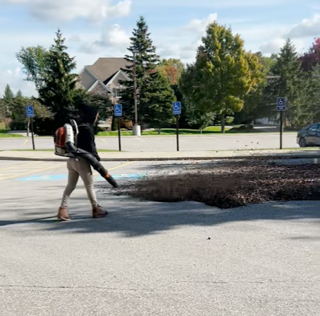 blowing leaves at a municipal property