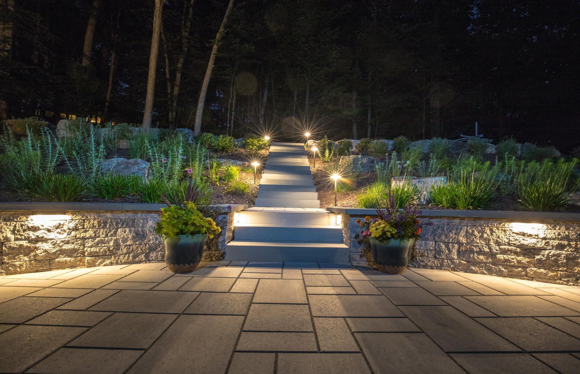 Ground Up Lawn Management landscape lighting in backyard