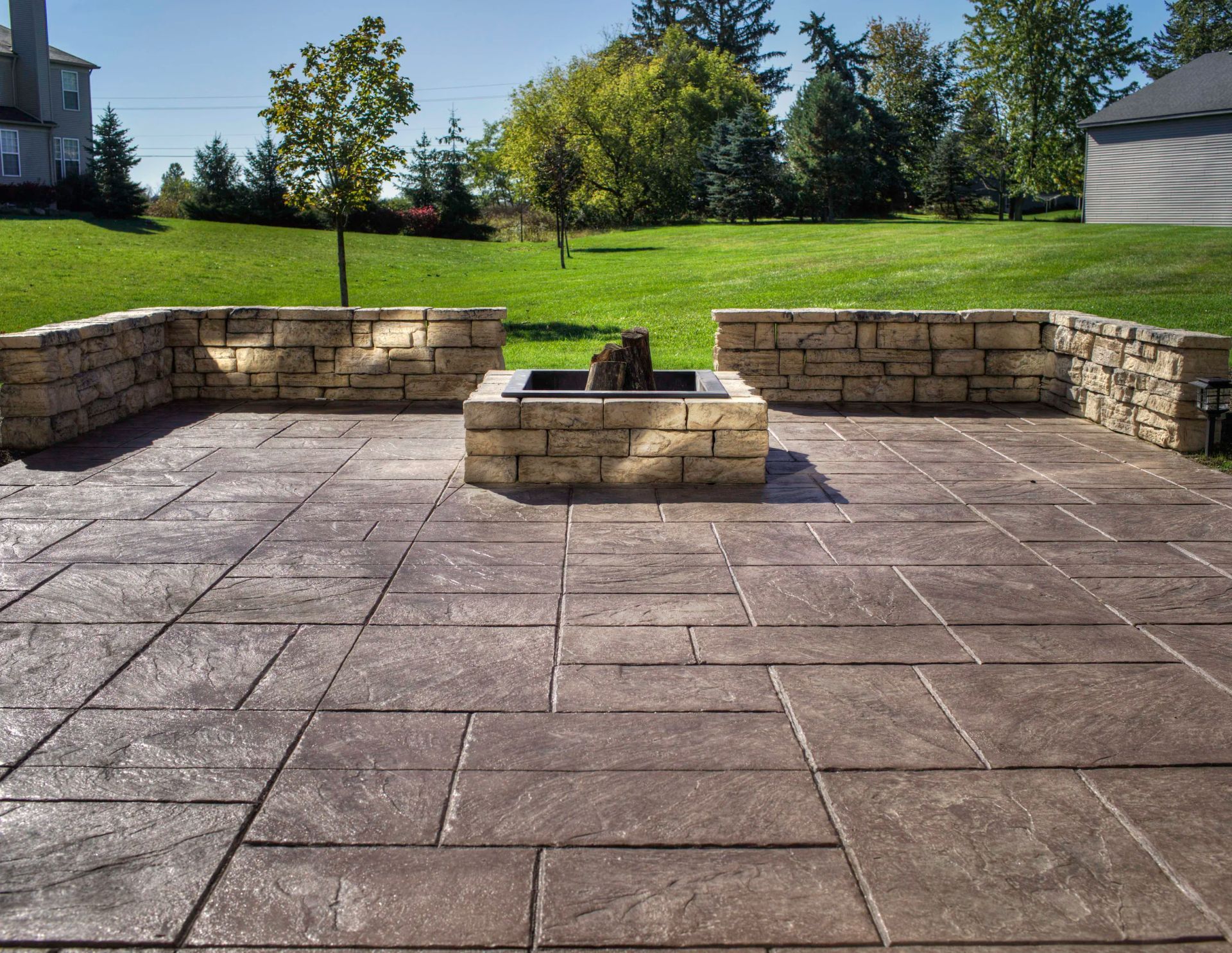 concrete patio with fire pit in Chardon