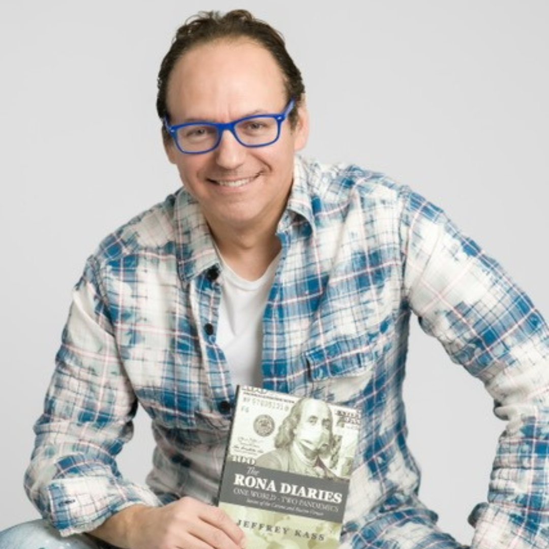 A woman in a pink dress is blowing a kiss while holding a microphone.