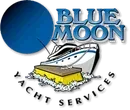 A blue moon yacht services logo with a boat and a sponge.