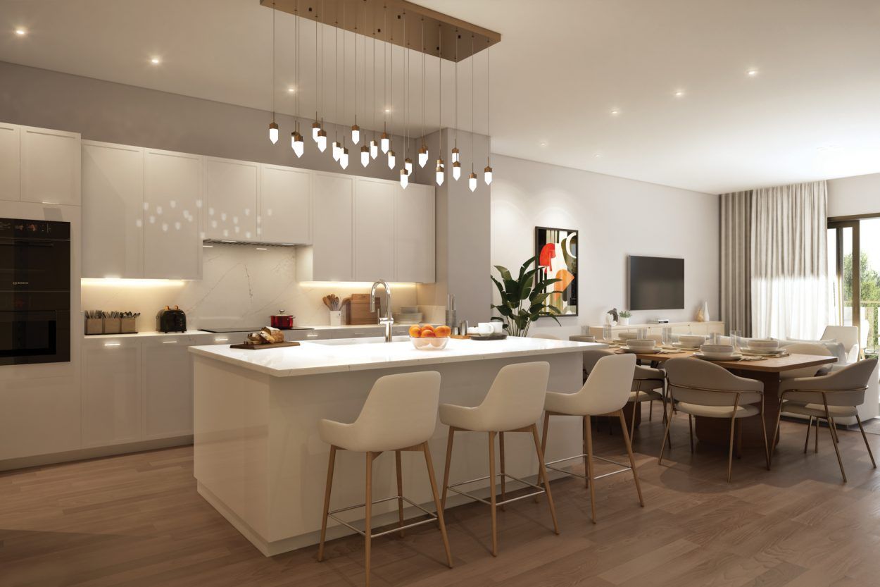 Cypress Sound luxury residence kitchen with oversized island, modern cabinetry, and open-concept dining area.