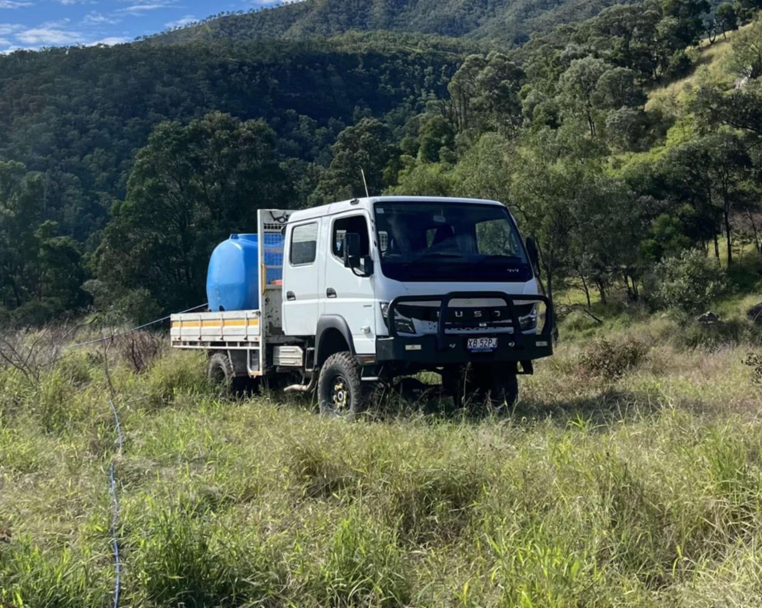 A Yellow Wagon Filled With Bags of Dirt — 2K Pasture Management and Consulting Ipswich, QLD