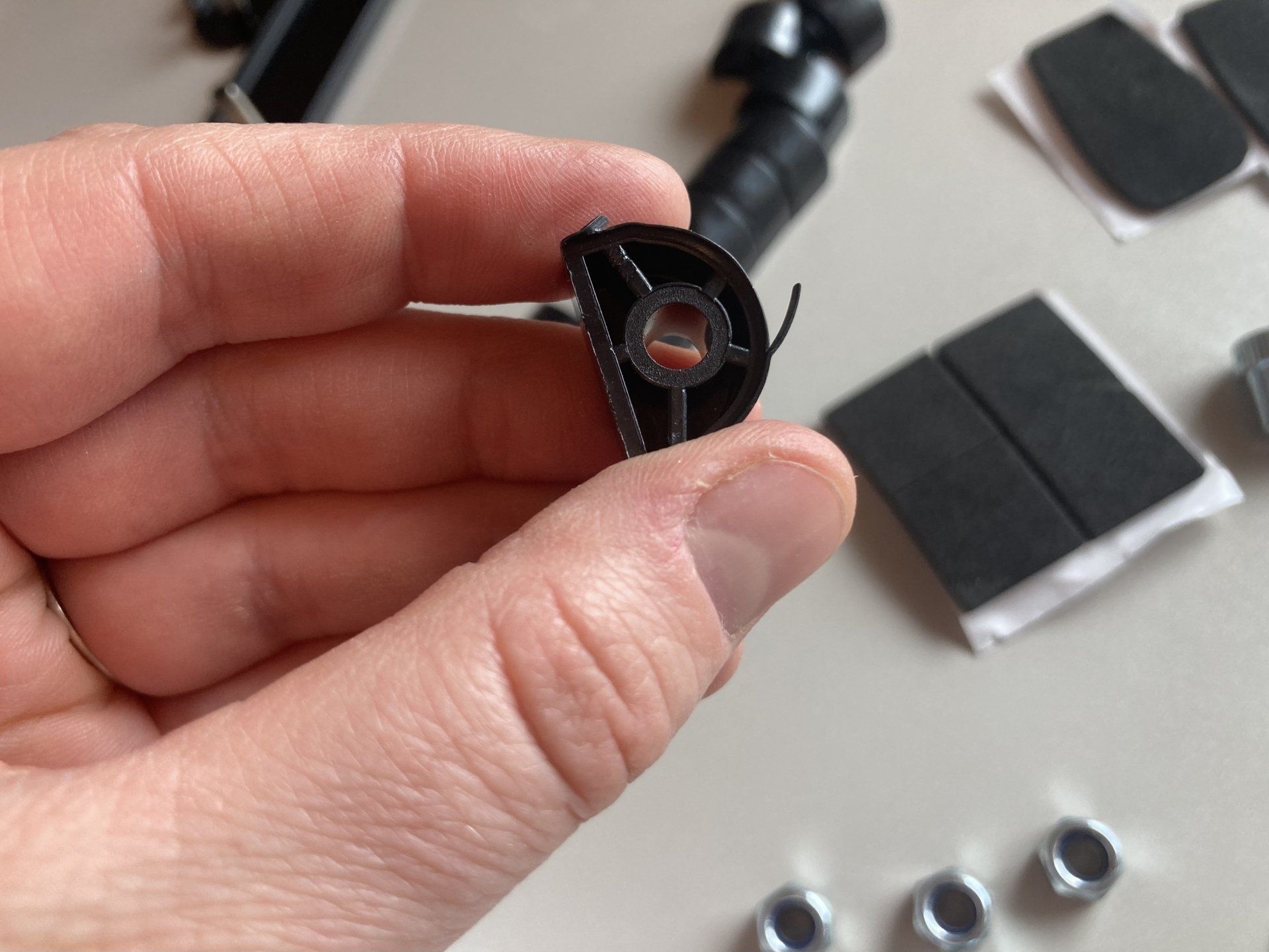 A person is holding a piece of plastic in their hand