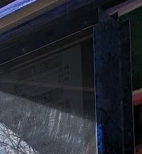 A close up of a window with a blue frame.