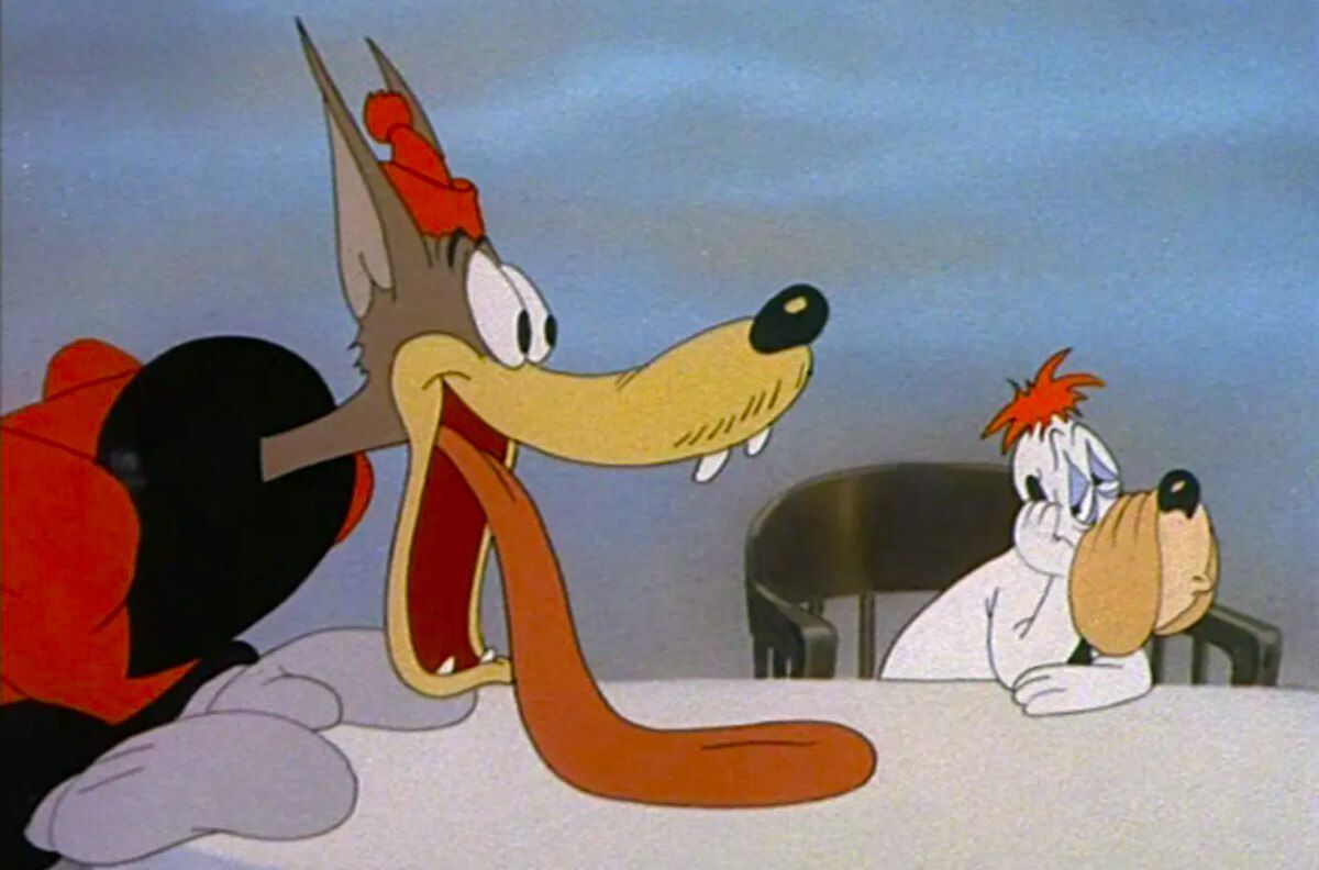 Wolf with long tongue, red hat, and bird at table, both startled. Table, blue background.