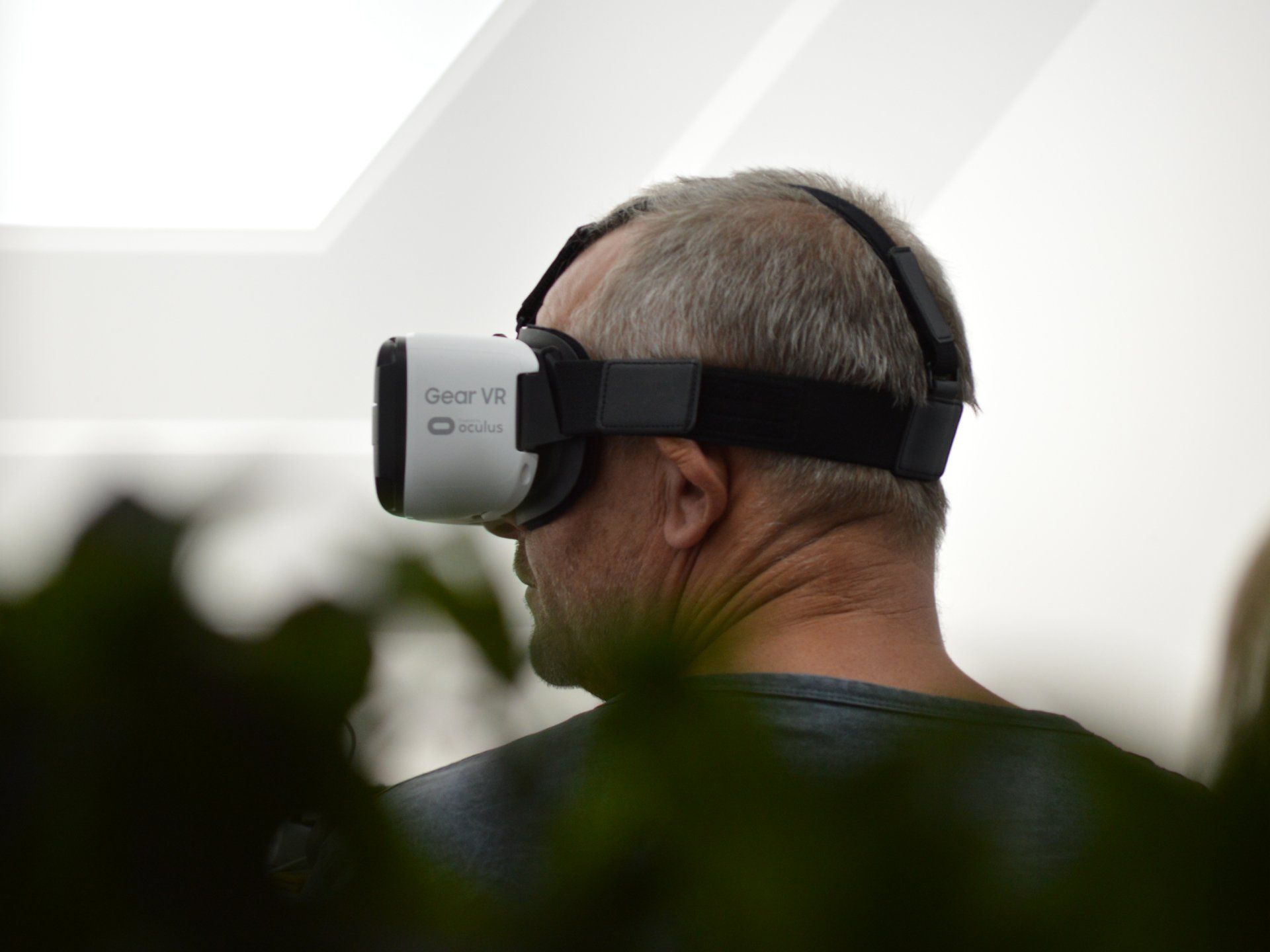 A man is wearing a virtual reality headset.