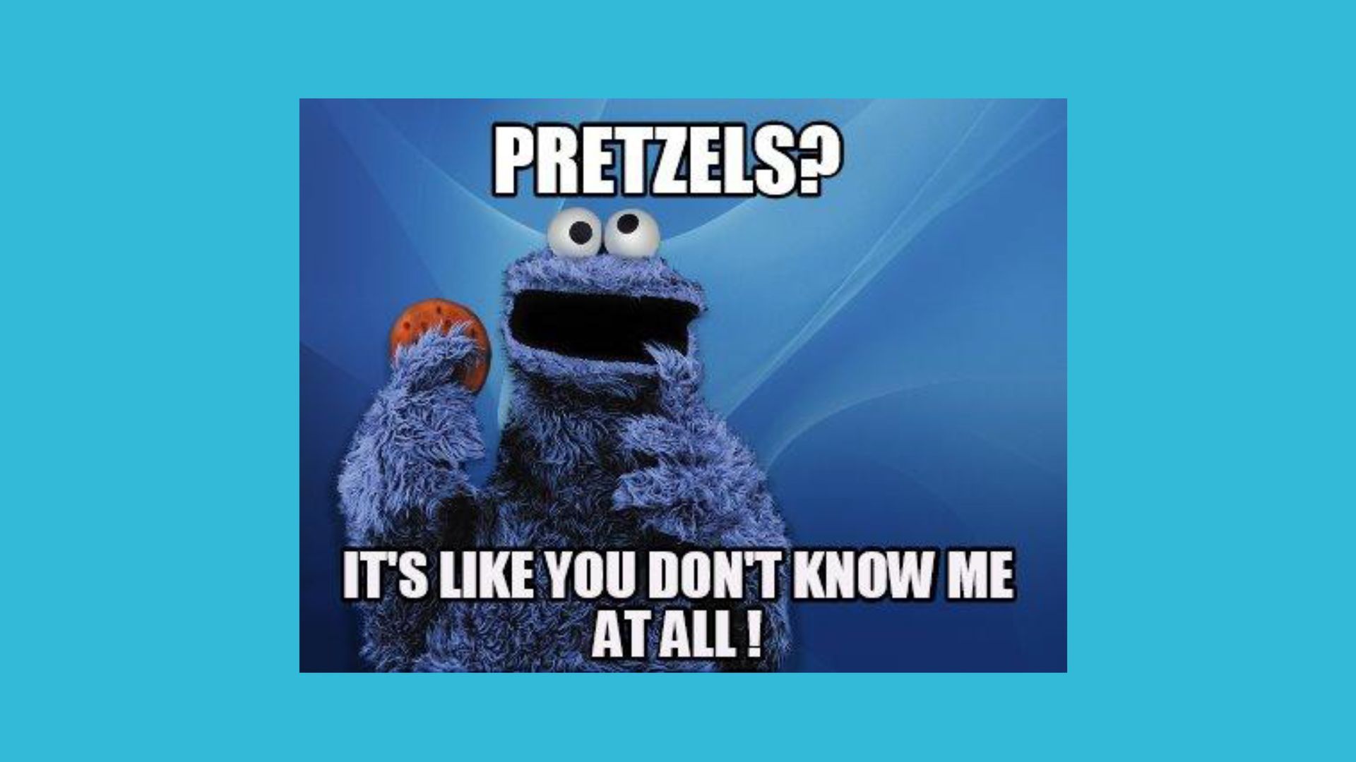 Cookie Monster holding a pretzel