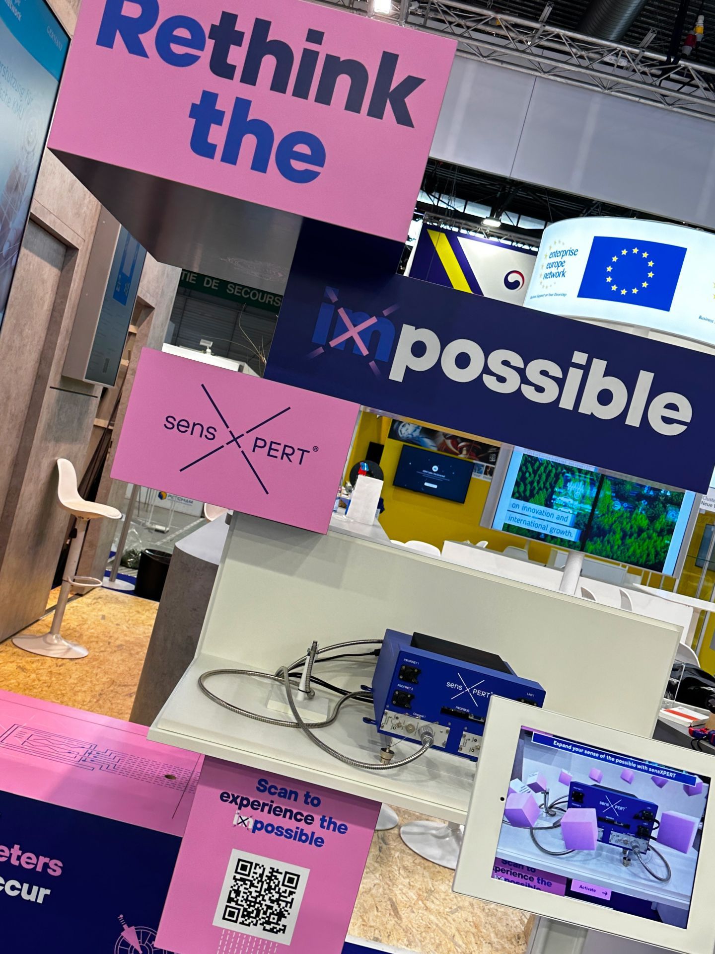 an event stand for sensXPERT that says