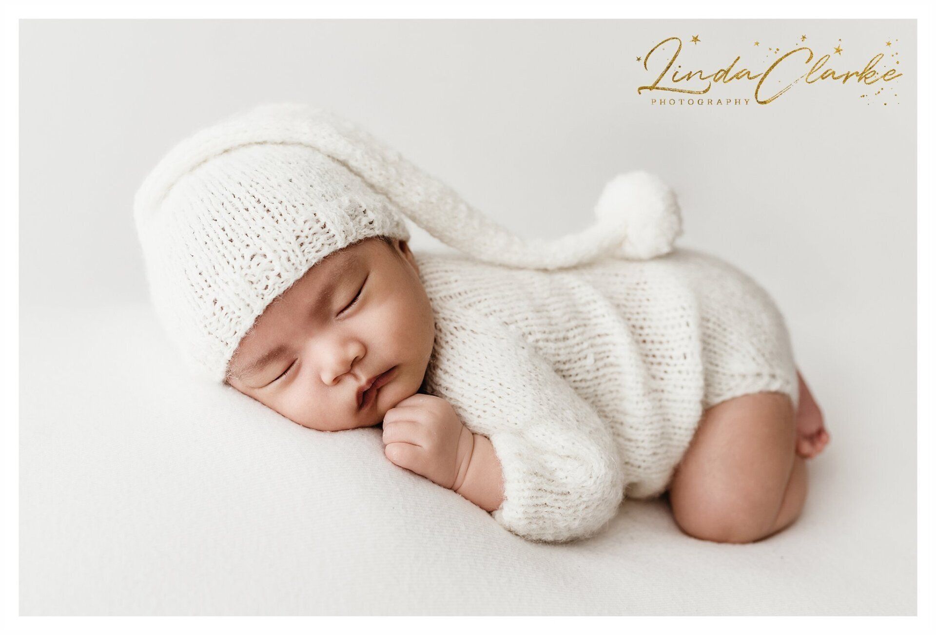 Newborn baby in cream outfit photographs Dublin